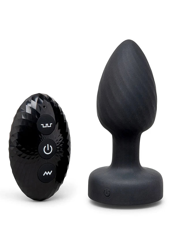 Black wireless butt plug set with a faceted oval remote control and a matte bulb-shaped plug on a white background.